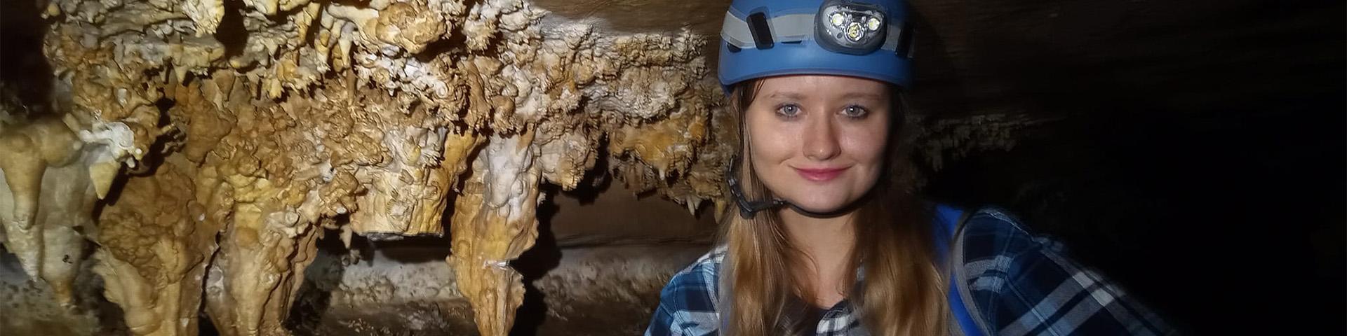 Girl in cave smiling